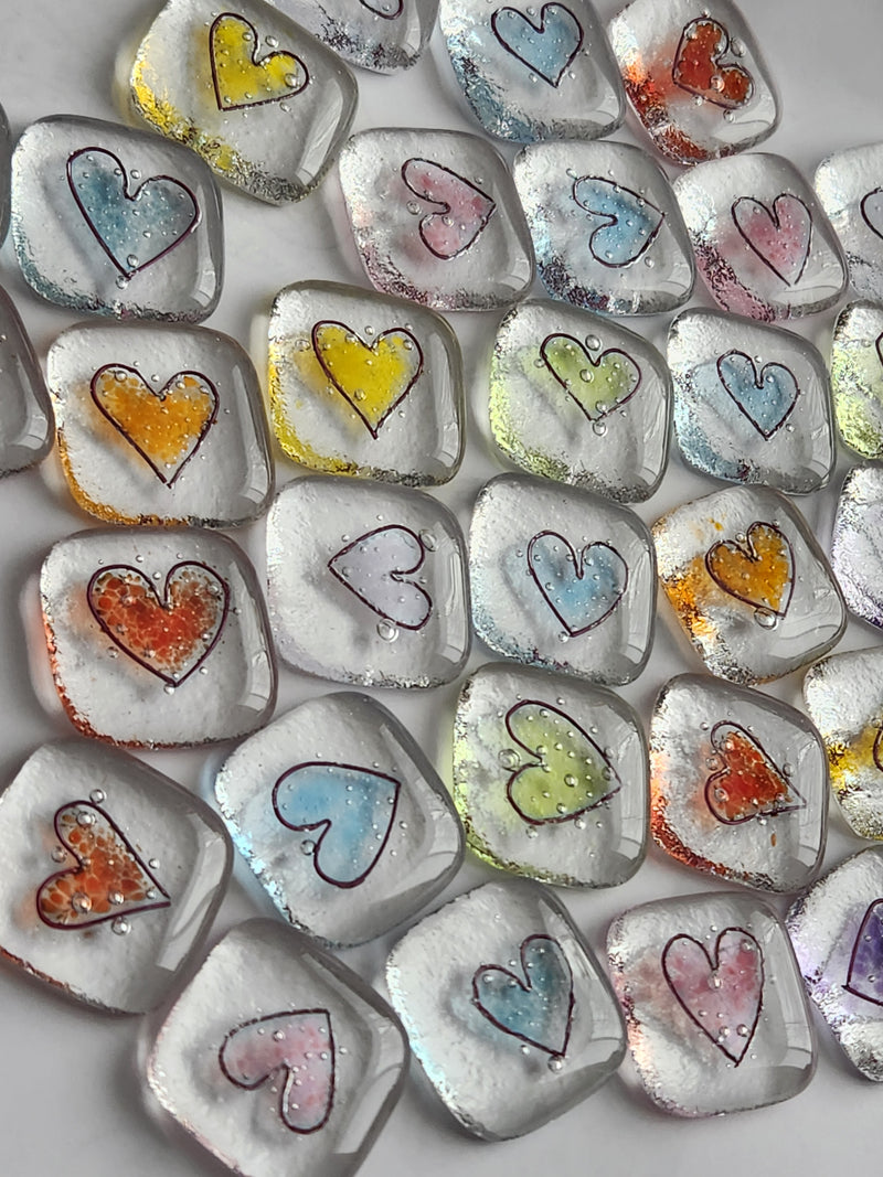 Many colorful glass hearts