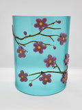 Fused glass Cherry Blossom Candle Curve with delicate pink and purple blossoms on an aqua background, designed for displaying LED candles, candles, or as floral home decor.