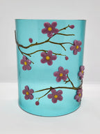 Fused glass Cherry Blossom Candle Curve with delicate pink and purple blossoms on an aqua background, designed for displaying LED candles, candles, or as floral home decor.
