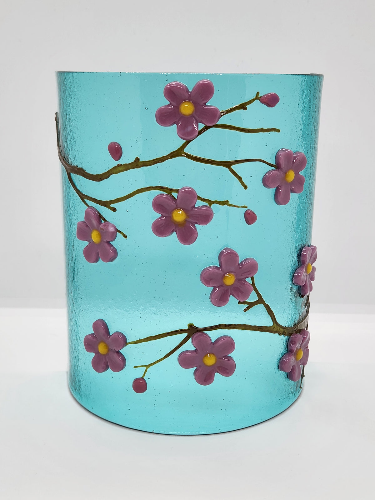 Fused glass Cherry Blossom Candle Curve with delicate pink and purple blossoms on an aqua background, designed for displaying LED candles, candles, or as floral home decor.