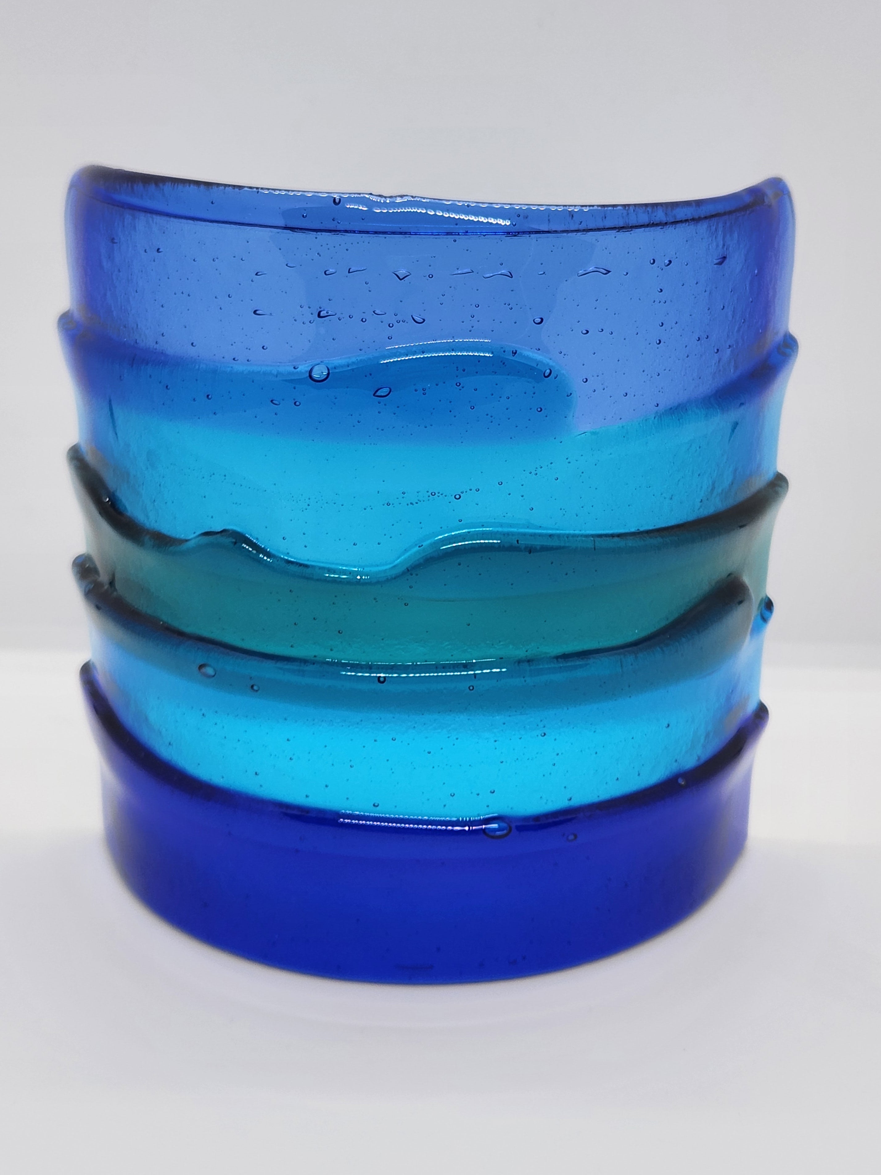 Blue fused glass Landscape Luminary with layered translucent glass designed to display candlelight or brighten a windowsill with soft natural light.