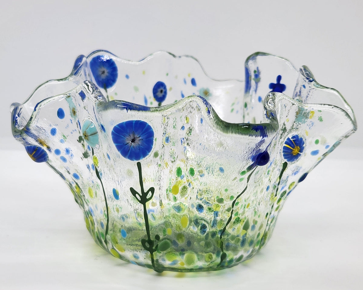 Mini wildflower bowl  with dark and light blue flowers covering the free form shape.