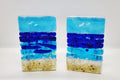 Fused glass Ocean Aqua candle holder with layered aqua, deep blue, and sandy glass, inspired by the colors of the shoreline and designed for home decor.