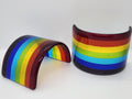 Fused glass Rainbow with vibrant bands of red, orange, yellow, green, blue, and purple that catch the sunlight and create colorful reflections for home decor.