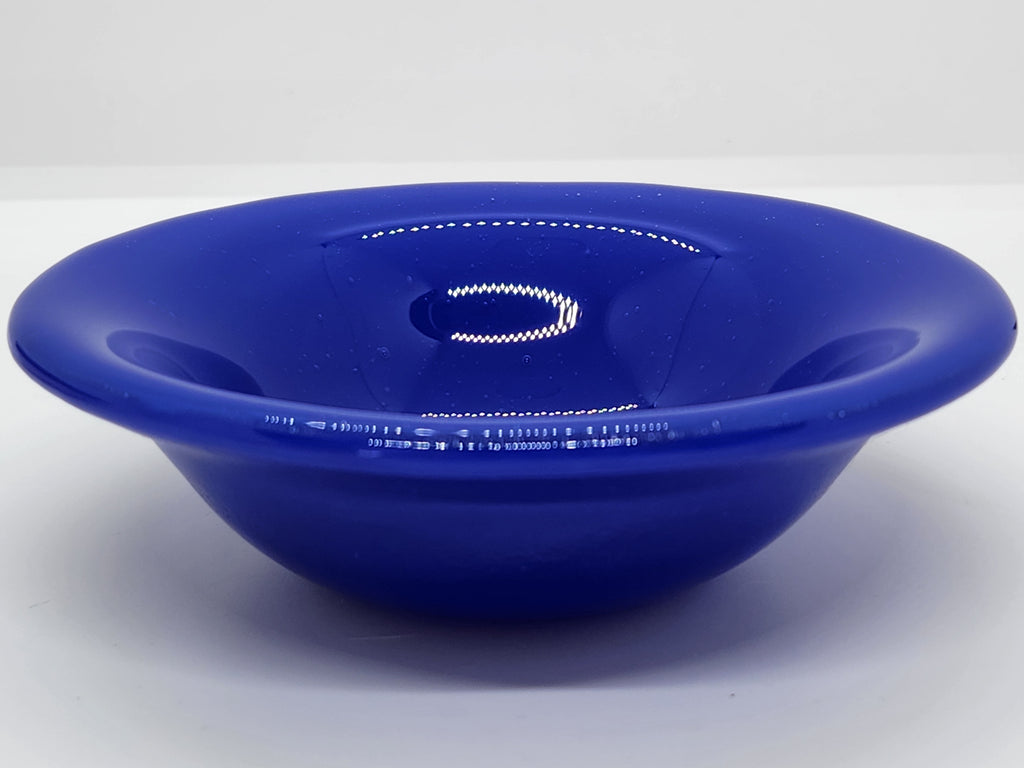 A small trinket glass bowl in cobalt blue.
