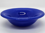 A small trinket glass bowl in cobalt blue.