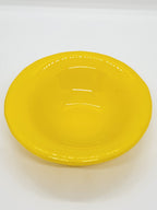 A bright yellow trinket dish with a glossy finish.