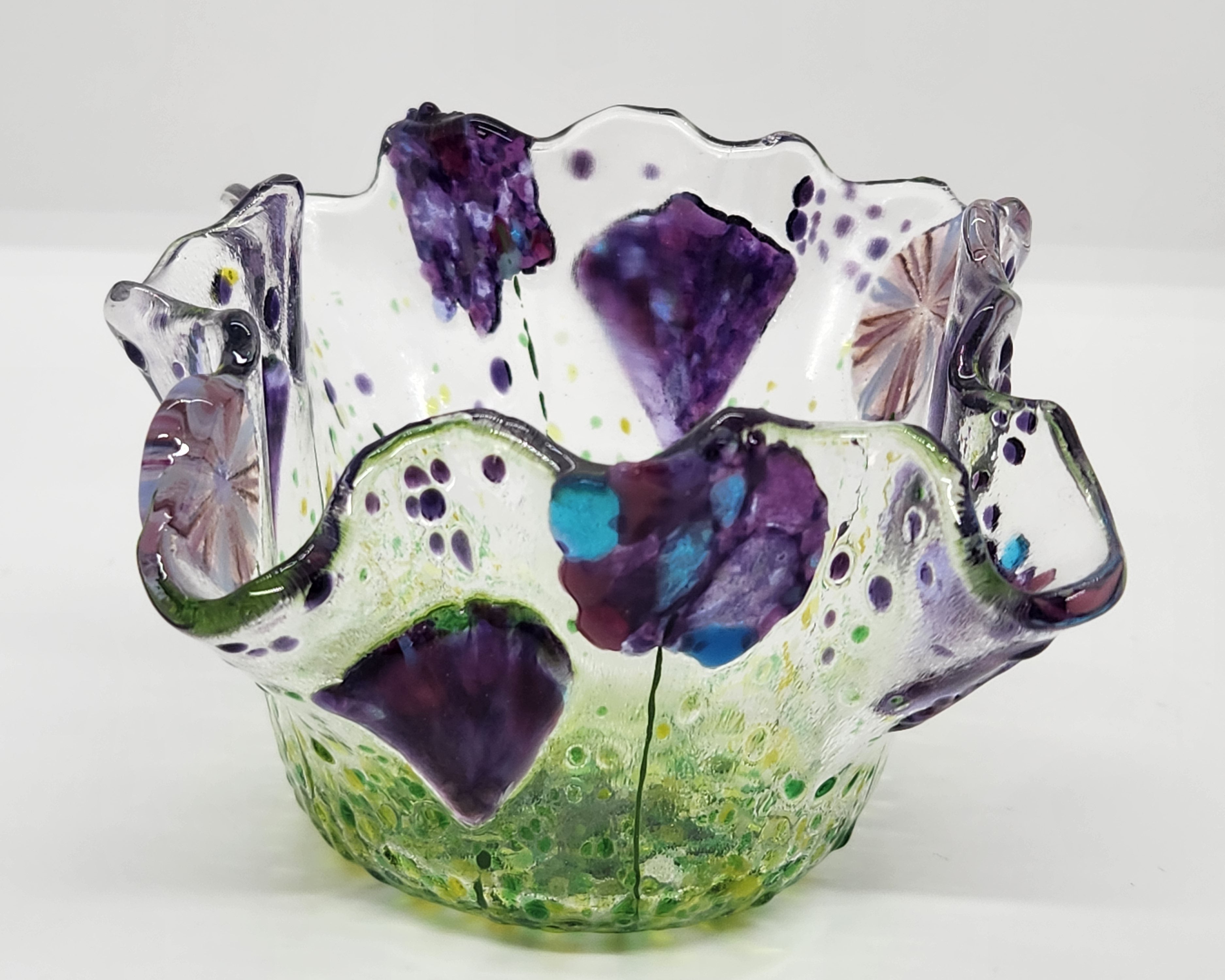 Mini wildflower bowl purple and blue flowers covering the free form shape. 