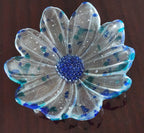 clear and blue glass bowl with a blue center on a brown background
