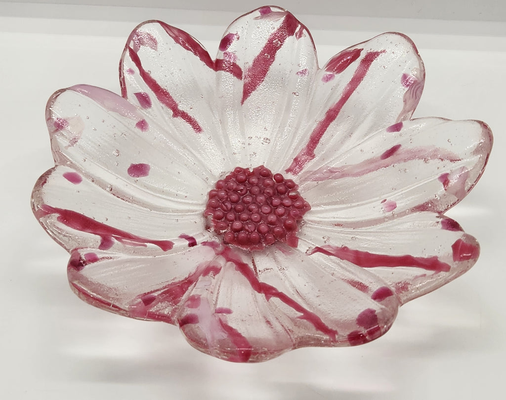clear glass bowl with pink accents and a pink center on a white background.
