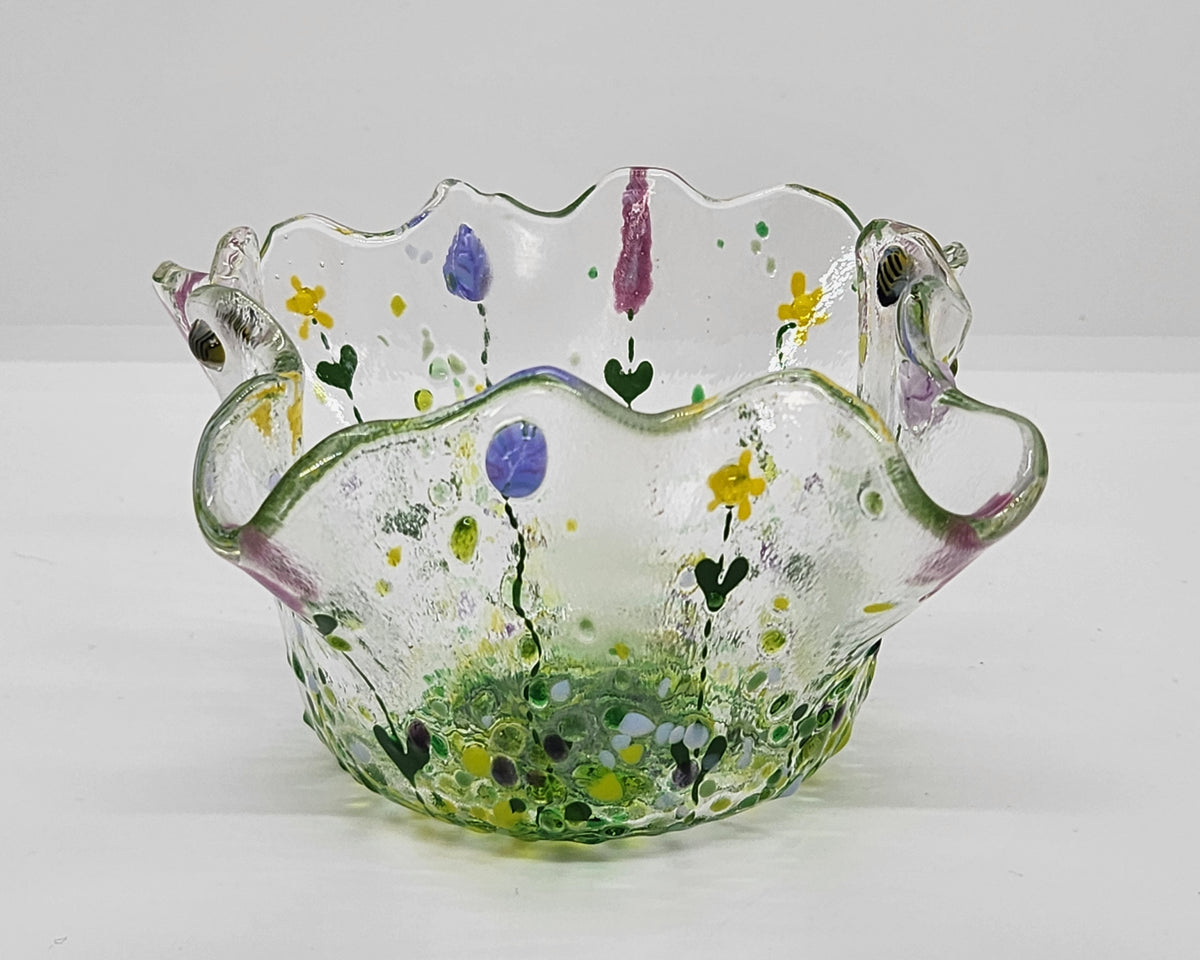 Mini wildflower bowl  with yellow, pink, purple, and green flowers covering the free form shape. Honey bees and other bugs are hiding in the fine details.