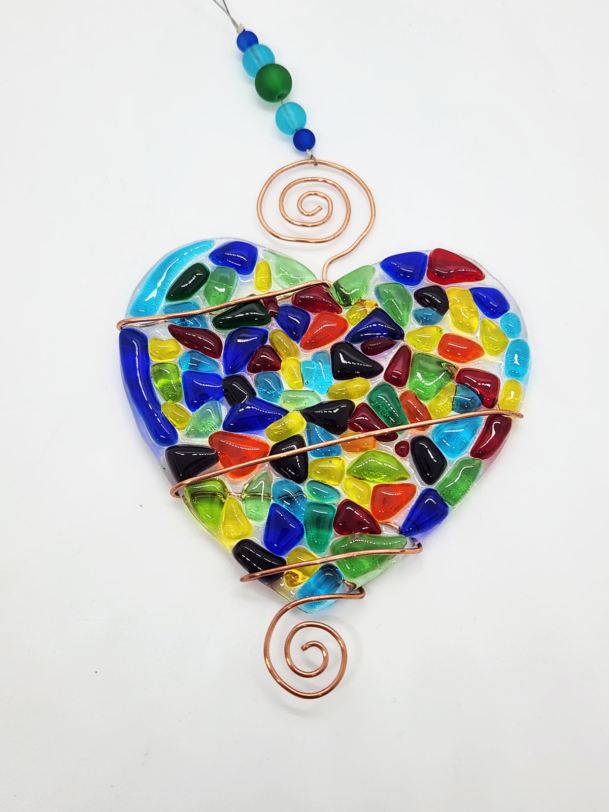 Rainbow heart suncatcher wrapped in copper wire with bead handle.